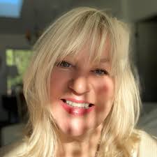 What is the best way to decorate a staff lounge with artwork or shelving?