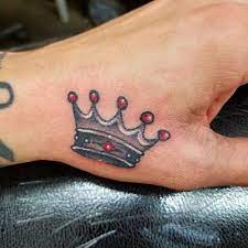 75 Symbolic Crown Tattoo Designs Nicestyles Crown Hand Tattoo Crown Tattoo Design Crown Tattoo
