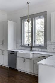Love The White Cabinets Farmhouse Sink And Gray Painted Window Trim In This Kitchen Barrow Bui Modern Farmhouse Kitchens Kitchen Remodel New Kitchen Cabinets