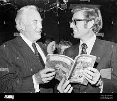 Chief Justice Warren Earl Burger with Sen. Pietro Vichi "Pete" Domenici,  R-N.M., talking over a book at the Capitol Hill Reception for the New  Washington Guide Book. April 1975 (Photo by CQ