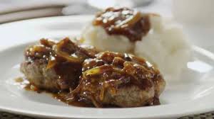 Hamburger steak is one of those lower priced items on most menu's. Hamburger Steak With Onions And Gravy Video Allrecipes Com