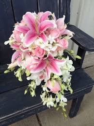After all it is the most important day of your life and you'll. I Love How They Balanced The Lillies With Other Flowers But I Don T Think I Want A Waterfall Bouqu Lily Bouquet Wedding Flower Bouquet Wedding Wedding Flowers