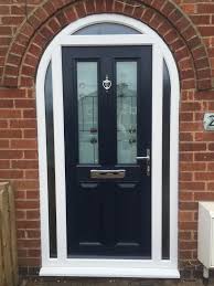 Can you change brown upvc windows to white? Dark Blue Composite Door In A White Upvc Arched Frame Installed By Windseal Double Glazing Composite Front Door Arched Exterior Doors Traditional Front Doors