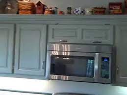 Glaze kitchen cupboards that are painted with a stain several shades darker than the paint color or with a deep brown for a true antique look. Paint And Glaze Kitchen Cabinet Refinish Youtube