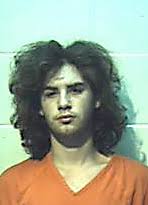 Suspect in kin slays no stranger to law, records show