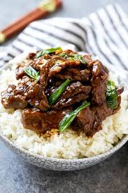 The best mongolian beef recipe is right here!! A Bowl Of Rice Topped With Slow Cooker Mongolian Beef Crockpot Recipes Beef Beef Dinner Slow Cooker Mongolian Beef Recipe