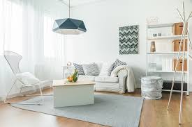 You can go for a few pieces of plain for example, if you have grey sofa/sectionals in your living room, try layering the same colour in different textured pieces; Minimalist Living Room Ideas Allied Siding And Windows