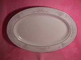 The white base color is augmented by a border that features pink, white & blue. Antiques Art Vintage