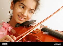 Children playing violin hi-res stock photography and images