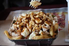You can't go wrong with the classic poutine, but anyone who wants to kick it up a notch should definitely go with the spicy sauce, which you can get on any kind of poutine. Your Typical Poutine From Chez Ashton In Ville De Quebec Poutine