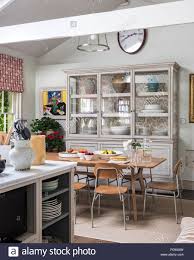 a large antique glazed cupboard in