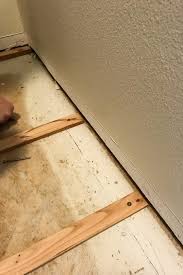 How To Fix An Uneven Subfloor Diy Home Improvement Installing Laminate Flooring Waterproof Laminate Flooring Diy Flooring
