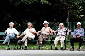 Sitting on a park bench. Elderly Men Sit On A Park Bench And Enjoy The Sun Abc News Australian Broadcasting Corporation
