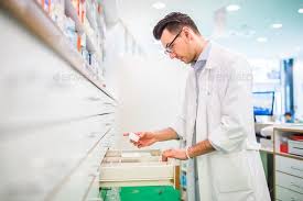 Portrait Of A Young Friendly Male Pharmacist Pharmacist Photography Websites Inspiration Background For Photography