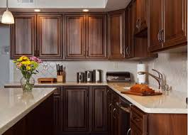 Dark kitchen cabinets are stunning, and picking the right countertop color to pair with your dark cabinets can make all the difference on your kitchen's style. How To Pair Countertop Colors With Dark Cabinets Kitchen Remodel Countertops Cherry Cabinets Kitchen Kitchen Design