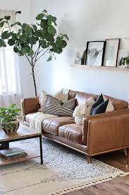 The Living Room Is Finally Almost Complete And This Sofa Is Definitely The Star Of The Show The Timber Cha Tan Sofa Living Room Tan Sofa Couches Living Room