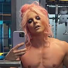 Jacked Courtney Act hits the gym and serves both Barbie and Ken