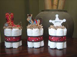 Decorations are what makes the difference between a good baby shower and a great baby shower. Set Of 3 Little Cowboy Mini Diaper Cakes Little Sheriff Mini Etsy Cowboy Baby Shower Cowboy Baby Shower Theme Baby Shower Vintage