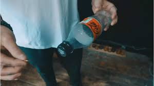 Slo Mo Coin in Bottle by Lloyd Barnes