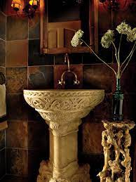 This Powder Room Is A Secret Grotto With Walls Covered In African Slate Slabs Accented By A Gilded Tuscan Bathroom Tuscan Bathroom Decor Mediterranean Bathroom