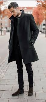 Turn heads on your next night on the town with a pair of black leather chelsea boots and black skinny jeans. Monochrome Combo With A Black Topcoat Black Sweater White Button Up Shirt Black Skinny Jeans Mens Winter Fashion Outfits Winter Outfits Men Mens Winter Fashion