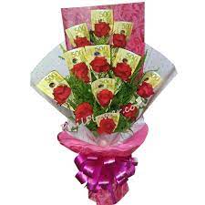 A beautifully designed bouquet of 2 dozen red roses and 2 dozen white roses in a vase. Delivery Money With 12 Red Roses In A Bouquet To Mania Philippines