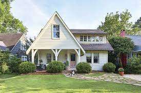 Green roofing is this home's statement feature and pairs well with the surrounding tree canopy. How To Pick The Right Exterior Paint Colors Southern Living