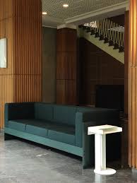 This modern sofa bed features simple lines and square armrests atop tall tapered legs, giving it a minimalist weight capacity: Standard Sofa Leibal