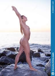 Nude Sporty Female is Standing on a Rock Stock Image - Image of harmony,  healthy: 212863027