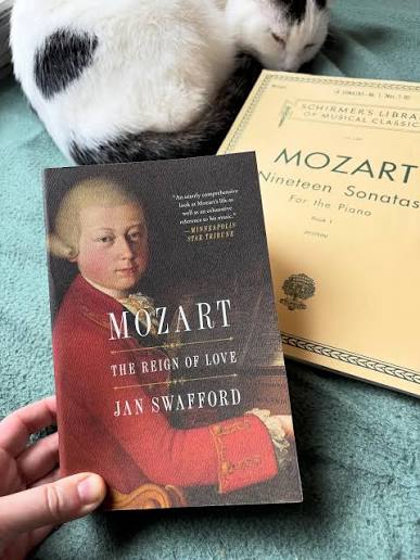 Made myself a nest in the window seat with Jello and finished my first book  of 2026 today! A 744 page beast of a biography on Mozart. It was soooo  good. Soooo