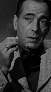 IN A LONELY PLACE (1950), Hollywood screenwriter Dixon Steele (Humphrey  Bogart) and his neighbor Laurel (Gloria Grahame) are just getting to know  each other romantically when the police begin ...