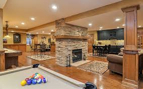 If you don't have the budget to do any renovating but you'd like to create a fun space in your basement, opt for something like this industrial pool room. Michael Nancy S Cozy Basement Remodel Aurora Il Basement Remodeling Basement Design Cozy Basement