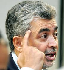 Asad Rauf raises his finger to send Sylvester Joseph