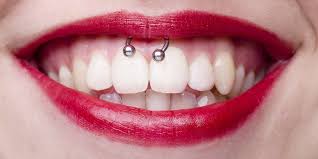 the smiley frenulum piercing everything you need to know