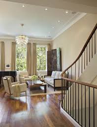 Pin By Pinpoint Painting Llc On Paint It Brown Stairs In Living Room Townhouse Interior Tan Living Room