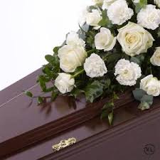 One dozen white roses to make a great day better. White Rose And Carnation Casket Spray Funeral Flowers London