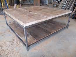 Coffee tables are like a noses, in that we don't think much about them, but without them things would look very strange. Large Quare Wood Coffee Table With Square Steel Legs Made Of Reclaimed Wood 17 Tall X 48 L X 48 W Coffee Table Coffee Table Wood Metal Wood Coffee Table