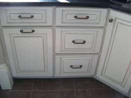 This small kitchen adapts a french provincial style, using all white for both the cabinets and the general surfaces. White W Pewter Glaze Glazed Kitchen Cabinets Remolding Kitchen Kitchen Bathroom Remodel
