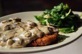 Pour gravy over schnitzel just before serving. Schnitzel With German Mustard Mushroom Gravy Recipe Food Pork Recipes Recipes