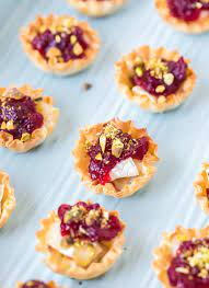 Baked brie with carmelized onions. Cranberry Brie Bites Video A Spicy Perspective