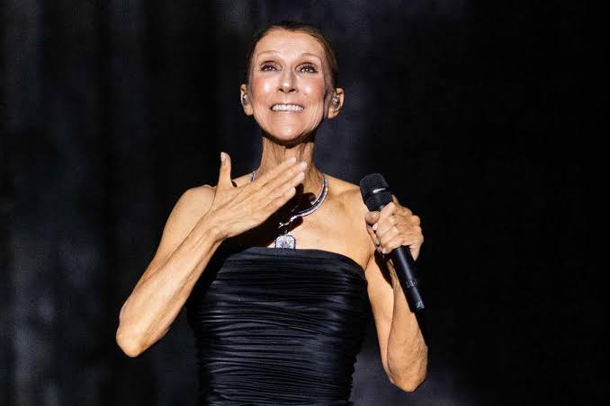 Celine Dion falls onstage during Paris concert, gracefully recovers