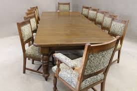 Many dining room tables and chairs are sold together as a dining set. Large Victorian Oak Dining Table And 12 Matching Chairs