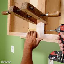 How To Install Cabinets Like A Pro Installing Cabinets Kitchen Appliances Layout Kitchen Wall Cabinets