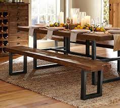 Benches are a less formal addition than chairs and go perfectly with rustic farmhouse chic decor. Griffin Reclaimed Wood Dining Bench Pottery Barn