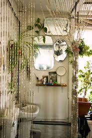 A contemporary meets boho space with potted greenery, baskets, rattan furniture, a wicker mirror and a ladder. Fascinating Bohemian Bathroom Ideas Perfect For Relaxation
