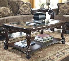 Mallacar 3 piece tables set by ashley. Norcastle Traditional Rectangular Cocktail Table With Tempered Glass Top Shelf Signature Design By Ashley Coffee Table Wood Coffee Table Coffee Table Frame