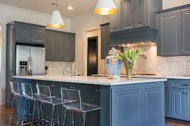Their beautiful blue and green colors evoke the sea while giving the cooking space a beachy vibe. Marble Chevron Kitchen Backsplash Transitional Kitchen