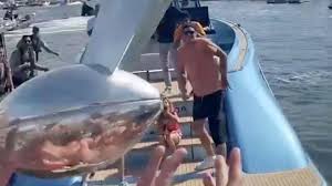 Aboard his own custom wajer yachts 55s vessel. Tom Brady Tosses Lombardi Trophy From Boat To Boat At Super Bowl Parade