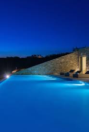 Infinity Pool At Night Modern Custom Home In Greece Real Stone Walls In 2020 Pool At Night Custom Homes Beautiful Modern Homes