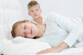 Brother And Sleeping Sister On The Bed. Stock Photo, Picture and Royalty  Free Image. Image 92722667.